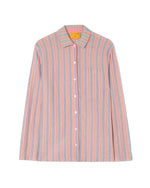 The Fine Stripe Showtime Shirt by Guest in Residence features a relaxed fit, long sleeves, vertical pink, blue, and white stripes, a front chest pocket, and a pointed collar.