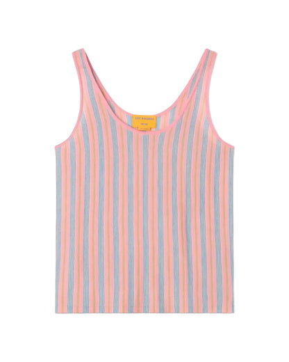 The Fine Stripe Tank by Guest in Residence is a sleeveless knit top with vertical pastel pink, blue, and yellow stripes on white, a scoop neckline, and a yellow tag inside the collar.