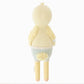Finley the Duckling by Cuddle + Kind is a soft, yellow plush toy shown from the back, dressed in a light blue striped jumper with a rounded tail and textured wings. Standing against a white background, this adorable 13" cuddly duckling makes a perfect birthday gift.