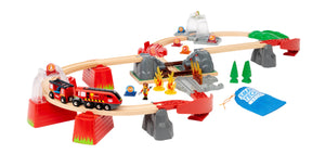 The BRIO World Fire Rescue Smart Tech Set by Brio is a vibrant toy set that includes tracks, bridges, tunnels, and a red and black fire rescue train. It comes with small figurines, trees, and a convenient blue bag. The Smart Tech Sound system adds interactive sounds for an immersive play experience.