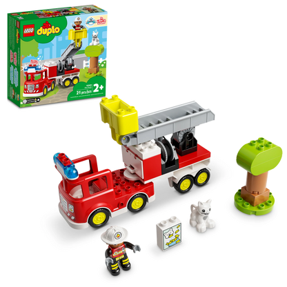 The LEGO® Duplo Fire Truck set by LEGO® includes a firefighter figure, white cat, tree, fire hydrant block, and set box—ideal for young kids who love toy fire trucks.