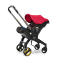 The Doona Car Seat and Stroller by Doona is a vibrant red and black stroller with yellow accents that seamlessly integrates a detachable car seat into its design, providing a convenient four-wheeled travel system.