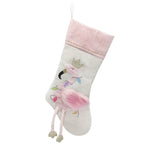 The Mon Ami Festive Flamingo Stocking showcases a delightful pink beauty—an elegant flamingo adorned with a crown, its legs charmingly draping over the edge, enhanced by sparkling Christmas lights.