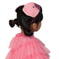 A child with black hair, styled in buns, is wearing a pink headband with ears and the Meri Meri Flamingo Cape Dress Up outfit by Meri Meri, facing away from the camera.