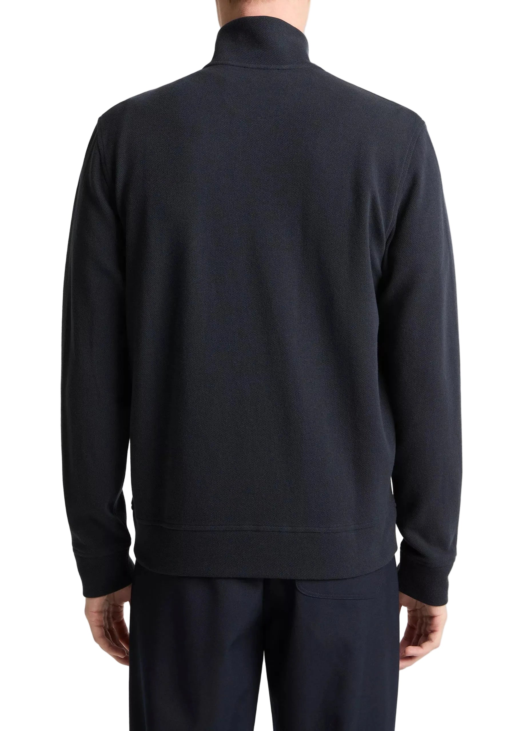 A person is shown from the back against a white background, wearing vince's Flat Back Piqué Full Zip jacket and matching pants with a minimal silhouette.
