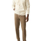 A person in a super soft High Standard Fleece Hoodie from Faherty, featuring a beige color and organic cotton fabric, complemented by brown pants and white sneakers, stands against a plain white background.