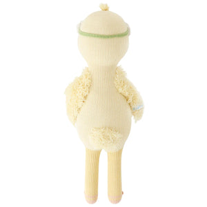 Flora the Duckling Ivory (Little 13") by Cuddle + Kind stands upright, facing away, with wings and tail visible—ready for new adventures among wildflowers.