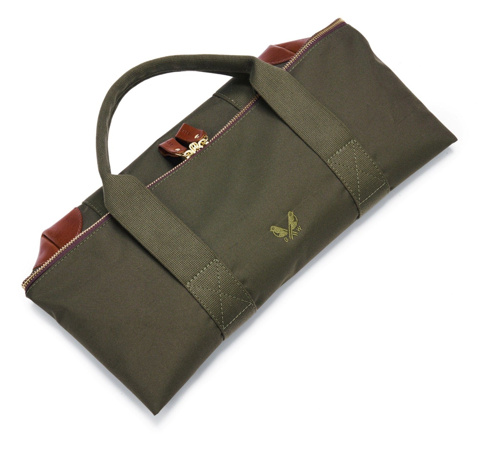 The Bennett Winch Medium Cargo by Bennett Winch is a green canvas toolkit bag with brown leather accents, featuring a carrying handle and an elegant butterfly emblem on the front. This heavy-duty kit bag also includes a removable pouch for added versatility.