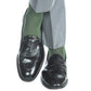 A person wearing gray pants, Dapper Classics Forest Green Ribbed Cotton Sock Linked Toe Mid-Calf, and black leather loafers with legs crossed.