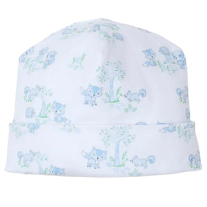 The Kissy Kissy Forest Fun Printed Hat is made from soft Pima cotton and showcases light blue animal illustrations, including foxes and squirrels, set against green botanical elements for a pink-themed design ideal for your little one's adventures.