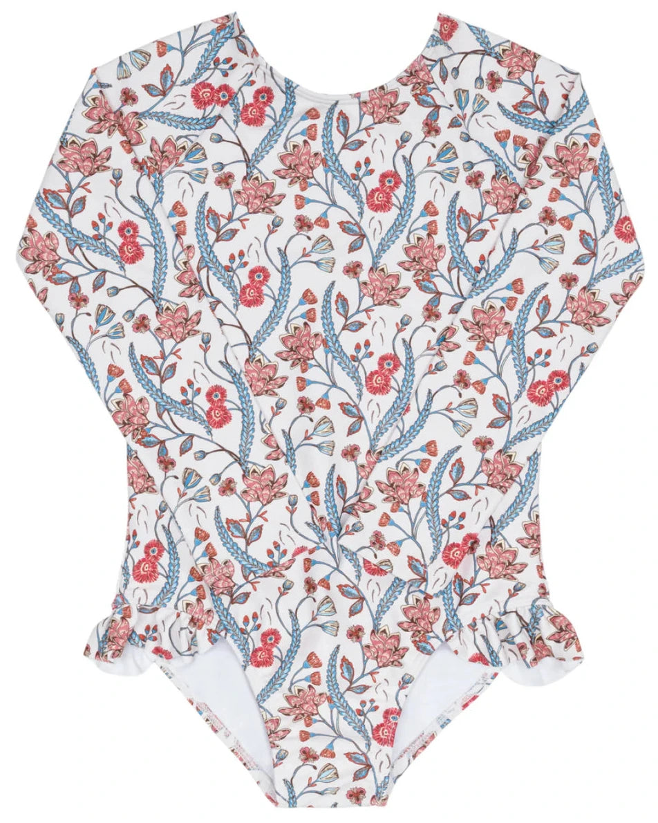 The Minnow Girls' Feathered Floral Rashguard One Piece is a sun-safe, long-sleeve swimsuit with a white base, red, blue, and pink floral print, plus delicate hip ruffles.