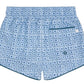 Minnow Boys' Starburst Boardie features a light blue geometric dark blue pattern, single back pocket with teal trim, elastic waistband, and comfy stretch liner.