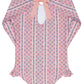 The Minnow Girls' Floral Tile Rashguard One Piece features long sleeves and a pink floral tile print—ideal as sun-safe swimwear or paired with your favorite girl's rashguard.