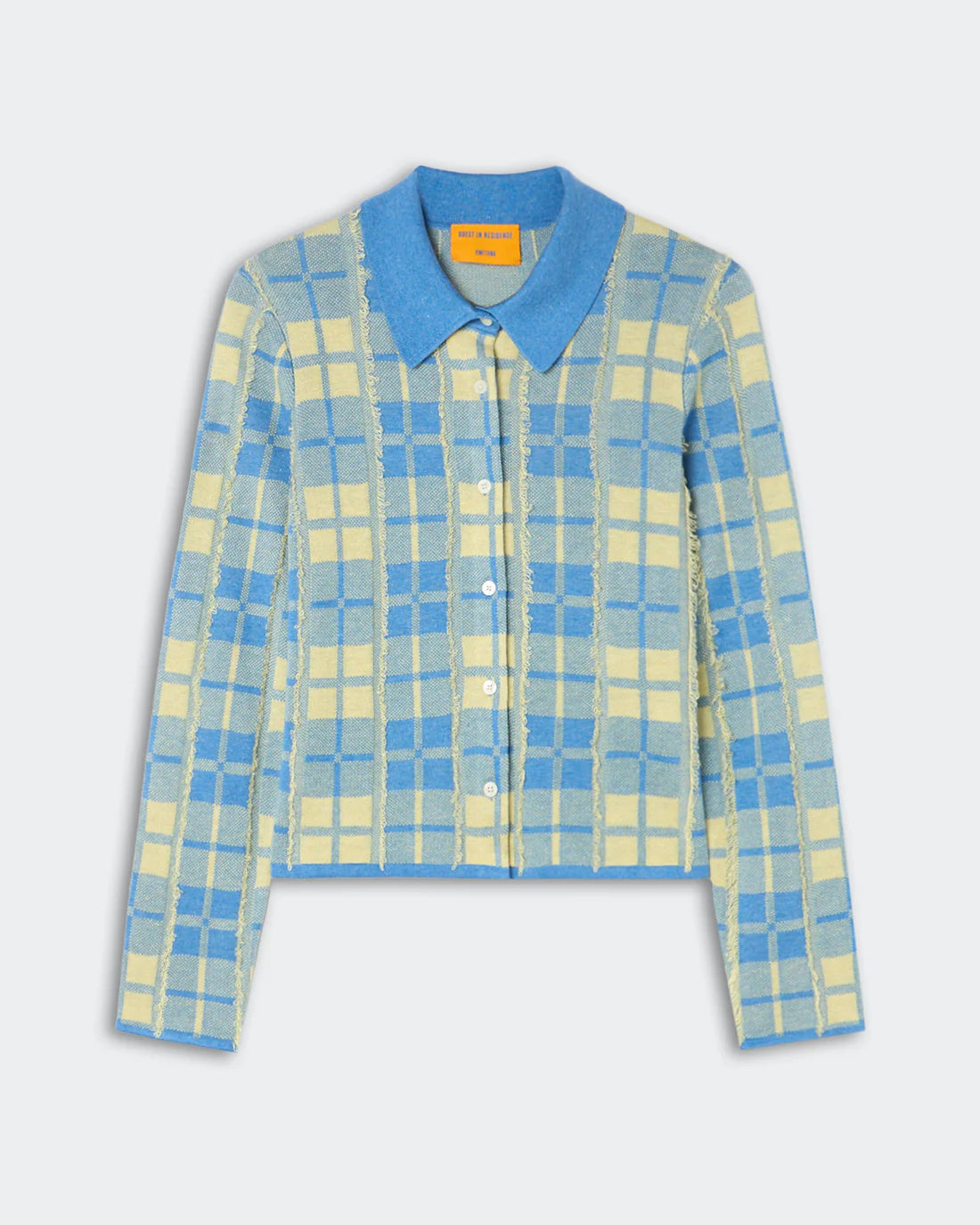 The Fringe Plaid Elle Shirt by Guest in Residence is a long-sleeve button-up cardigan with a blue and yellow plaid pattern reminiscent of a classic plaid shirt, featuring a blue collar and front buttons, laid flat on a light background.