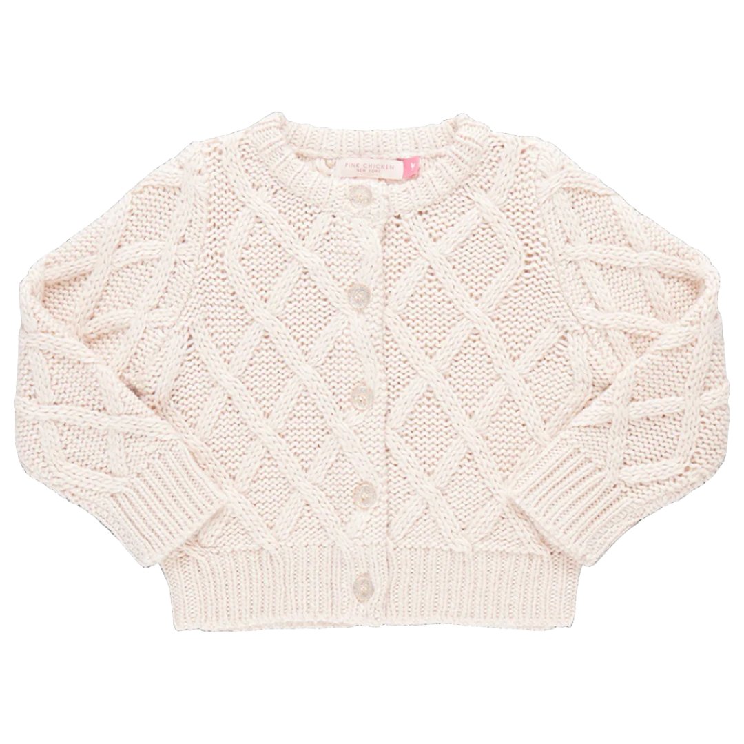 The Pink Chicken Girls' Katrina Sweater, a knitted white baby cardigan, features a charming diamond pattern and glitter button closure.