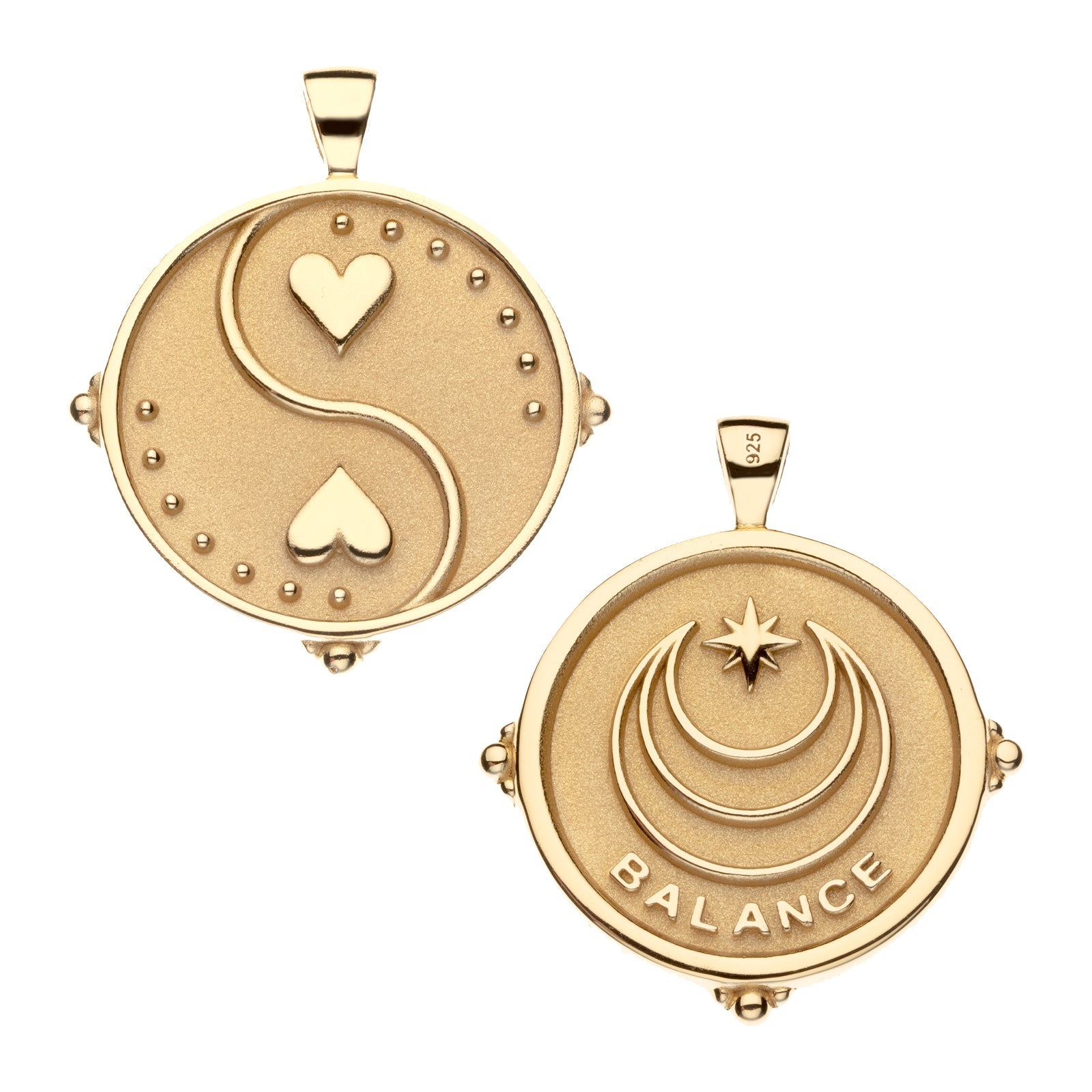 The Jane Win Pendant Necklace Collection features two round gold coin pendants: one with a yin-yang heart and dot accents, the other with crescents, a star, and "BALANCE" engraved—meaningful jewelry for any milestone.