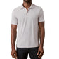 A man wearing the Faherty Movement Polo in light gray and white stripes paired with dark pants, standing against a white background.