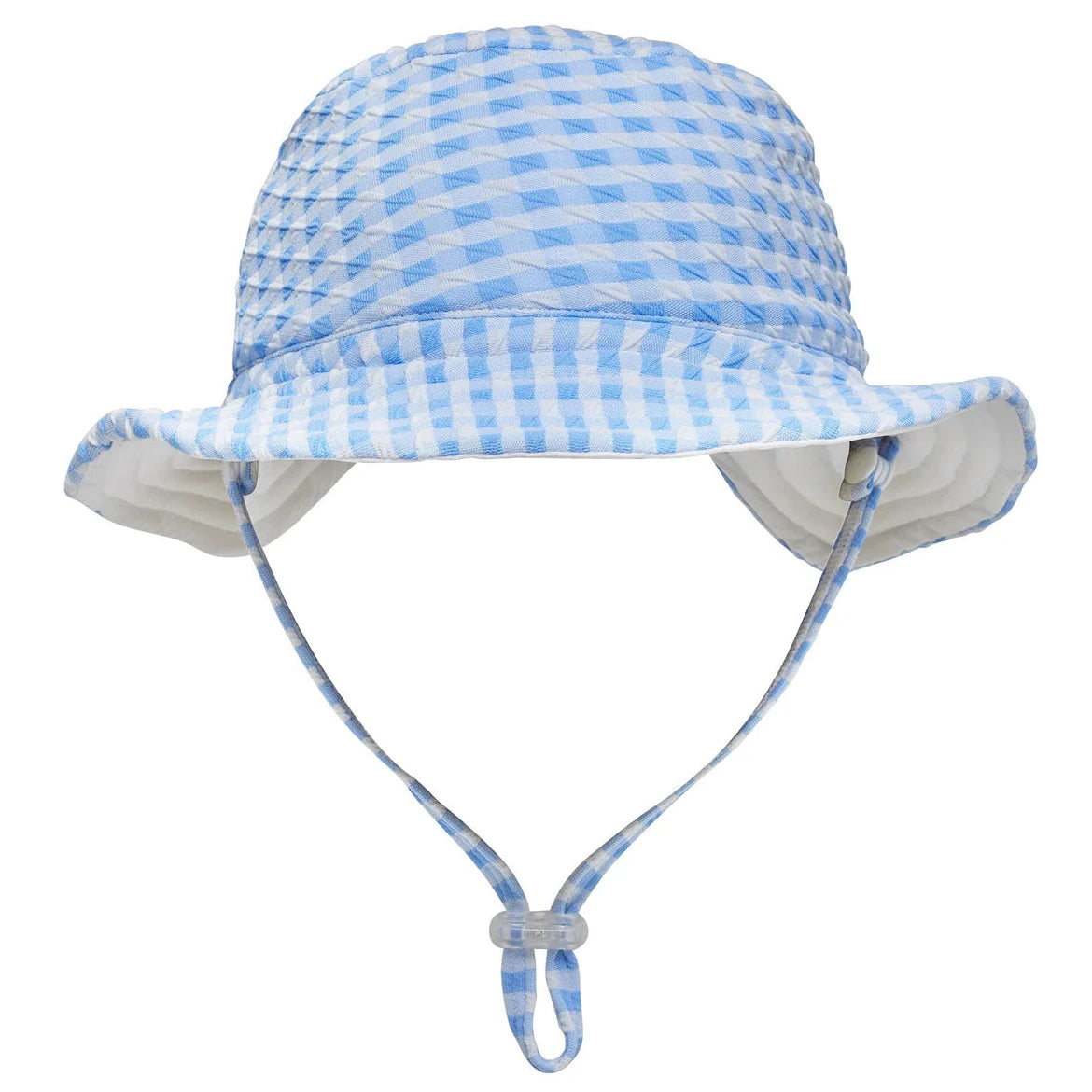The Snapper Rock Seaside Gingham Reversible Bucket Hat features a light blue and white checkered design, UPF50+ sun protection, a chin strap, and adjustable toggle—perfect for kids on sunny days. Displayed on a white background.