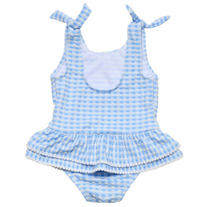 The Snapper Rock Baby Girls' Seaside Gingham Skirt Swimsuit features blue and white gingham, shoulder tie straps, a ruffled detail, and UPF50+ sun protection for stylish safety at the beach.