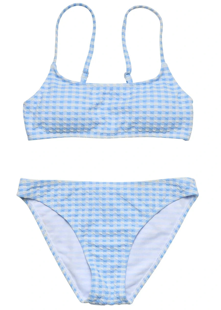 The Snapper Rock Girls' Seaside Gingham Teen Crop Bikini features a blue and white gingham pattern, a scoop neck crop top with adjustable straps, and matching bikini bottoms.
