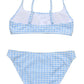 The Snapper Rock Girls' Seaside Gingham Teen Crop Bikini is a two-piece with a light blue and white checkered pattern, adjustable shoulder straps, and high-waisted bottoms.