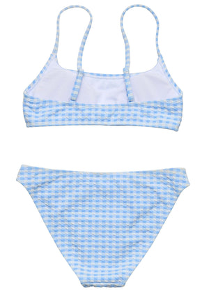 The Snapper Rock Girls' Seaside Gingham Teen Crop Bikini is a two-piece with a light blue and white checkered pattern, adjustable shoulder straps, and high-waisted bottoms.