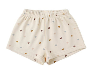 Rylee & Cru Girls' Track Short: comfy beige French terry shorts with an elastic waist and an all-over multicolored heart pattern.