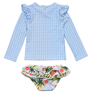 The Snapper Rock Baby Girls' Ciao Paradiso Ruffle Set features a blue and white checkered long-sleeve top with ruffled shoulders and fruit-palm bikini bottoms, all crafted from recycled fabric.