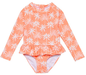 The Snapper Rock Baby Girls' Cali Palms Recycled Skirt Surf Suit features a peach color, white palm tree print, ruffled waist, and snap buttons at the crotch.