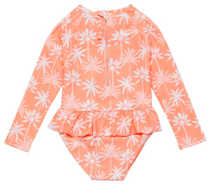 The Snapper Rock Baby Girls' Cali Palms Recycled Skirt Surf Suit is a peach, long-sleeve swimsuit with white palm trees, ruffle skirt, and back zipper—ideal for sunny adventures.