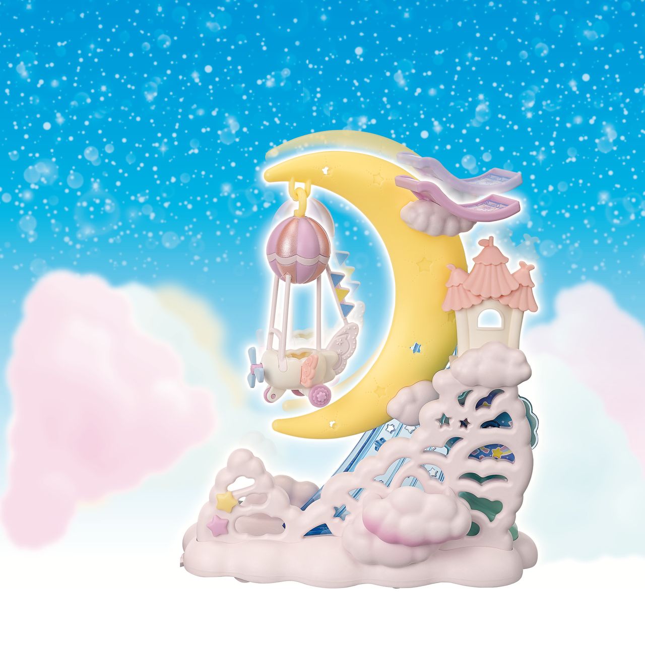Experience a whimsical world with the Calico Critters Daydream Parade Playset, featuring a pastel scene with a crescent moon float, a carriage-shaped swing, clouds, a tiny castle, sparkling stars, and drifting clouds against a shimmering blue sky.