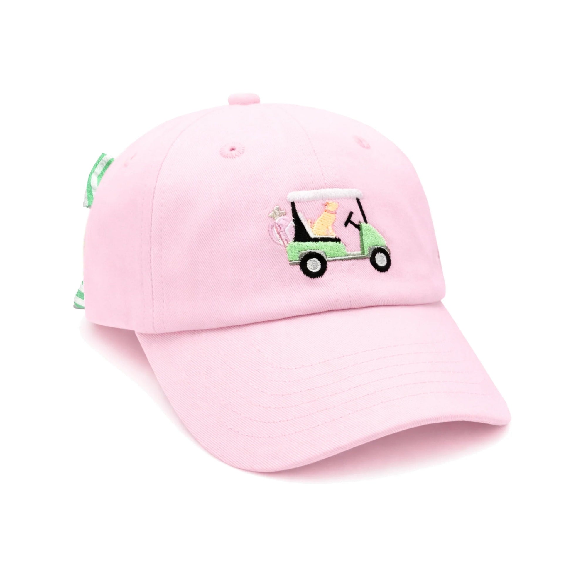 The Dog Golf Cart Bow Hat by Bits & Bows is a light pink baseball cap featuring an embroidered design of a person driving a green golf cart filled with golf clubs. This delightful hat offers playful style and comfortable sun protection, making it the perfect golf accessory for kids.