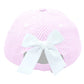 The Lil Sis Bow Baseball Hat by Bits & Bows features pink and white striped seersucker fabric and a large white bow attached at the back.