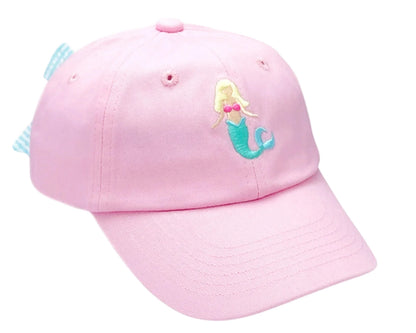 The Bits & Bows Blonde Mermaid Bow Baseball Hat, made from light pink cotton twill, features an embroidered blonde mermaid with a green tail and pink top—ideal for summer sportswear.