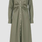 The Genny Dress by Callas Milano is a long sleeve, olive green Italian shirting twill dress with a button front, mandarin collar, fitted waist, and cuffs, shown on a plain background.
