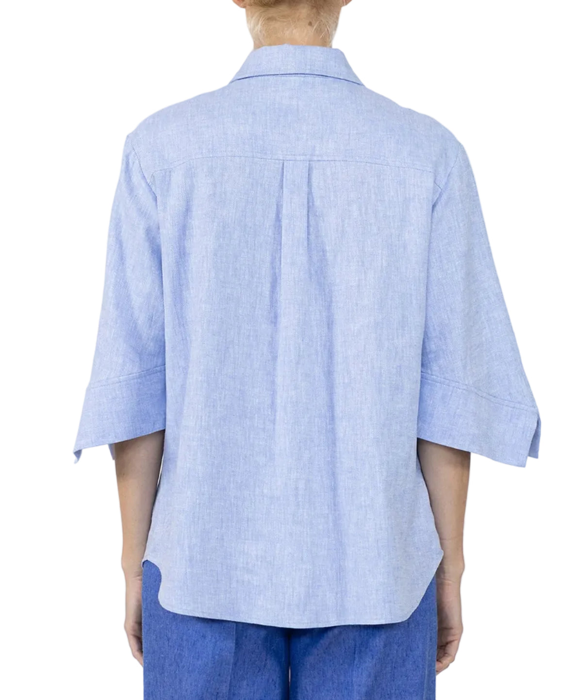 A person is seen from the back wearing the Callas Milano Georgie Top in light blue, featuring three-quarter sleeves and a point collar, paired with blue pants.