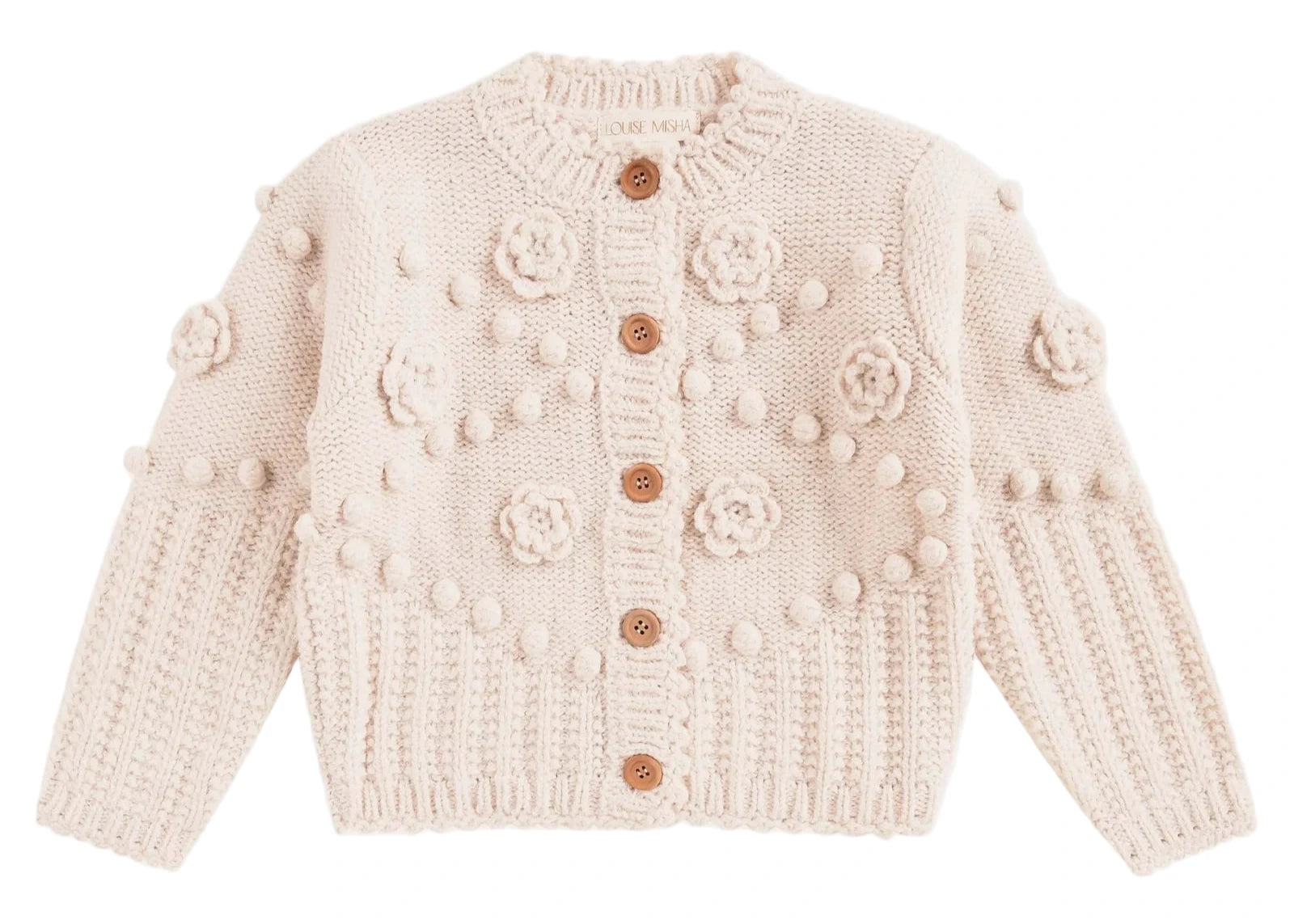 The Baby Girls' and Girls' Sandy Cardigan by Louise Misha is a cream-colored knit with wooden buttons, textured bobbles, and hand-crocheted floral patterns adorning the front and sleeves.