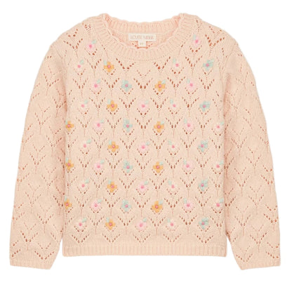 The Girls' Jadeli Jumper by Louise Misha is a light pink knit sweater featuring a lace pattern and delicate handmade embroidery of small pastel florals.