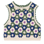 The Girls' Rynia Crochet Top by Louise Misha is a hand-crocheted sleeveless crop top with a vibrant floral granny square pattern in green, cream, white, blue, and purple.