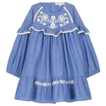 The Louise Misha Girls' Orana Dress features blue cotton chambray, white floral embroidery, lace trim, ruffled chest detail, and a flared hem.