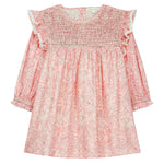 The Girls' Saralou Dress by Louise Misha is a pink cotton gauze long-sleeve dress with a white floral print, smocked chest, ruffled shoulders, and elastic cuffs.