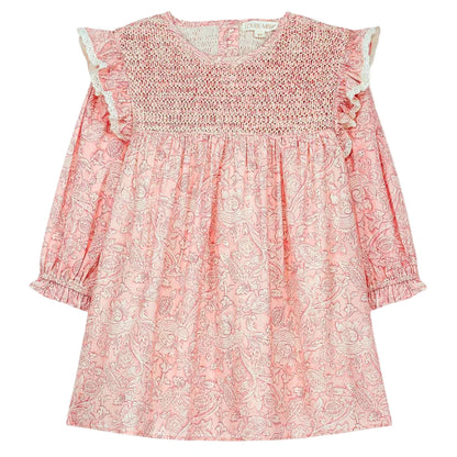 The Girls' Saralou Dress by Louise Misha is a pink cotton gauze long-sleeve dress with a white floral print, smocked chest, ruffled shoulders, and elastic cuffs.