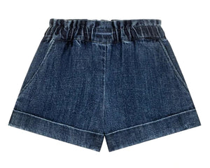 The Girls' Virgina Shorts by Louise Misha are dark blue denim with an elastic waist, side pockets, and a wide fit, shown against a white background.