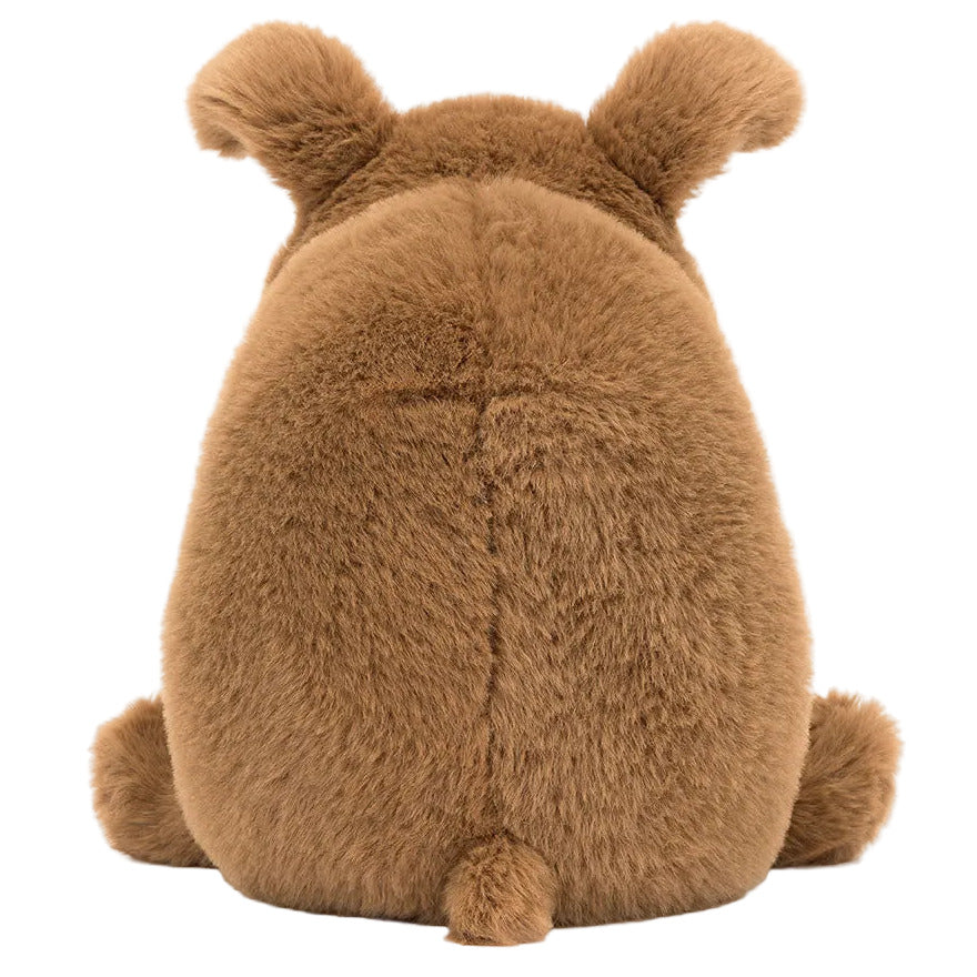 The Jellycat Derreck Dog plush toy features a round, fluffy body, visible ears, and a small tail, shown from the back.