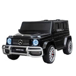 Freddo Mercedes G63 AMG 24V 2 Seater Ride On: a black toy car featuring blue LED lights, silver detailing, and authentic AMG branding, mirroring the iconic Mercedes-Benz AMG G Wagon.