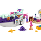 The LEGO® Gabby & MerCat's Ship & Spa building toy set from Legos - Toyhouse features a colorful toy boat, a small pink-clad figure, an octopus, starfish, and various accessories including a treasure chest filled with jewels.