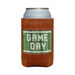 A can in a Smathers & Branson Game Day Can Cooler—a brown leather holder featuring a green patch with "GAME DAY" in white letters.