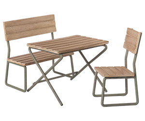 The Maileg Garden Set, Miniature by Maileg is a metal-framed wooden bench, chair, and table set designed for outdoor use. This vintage garden set is perfect patio furniture, made from FSC wood to ensure sustainability while enhancing your outdoor space with timeless charm.