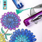 Bright Stripes' Glitter Gel Pens create colorful flower and butterfly drawings. Shown: 2 of 12 pens with vibrant, long-lasting ink.