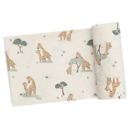 The Angel Dear Giraffe Families Swaddle Blanket showcases a delightful print of illustrated giraffes and trees on a light background. Made from soft and stretchy fabric, its versatile design makes it ideal for swaddling or enjoying cozy cuddles.